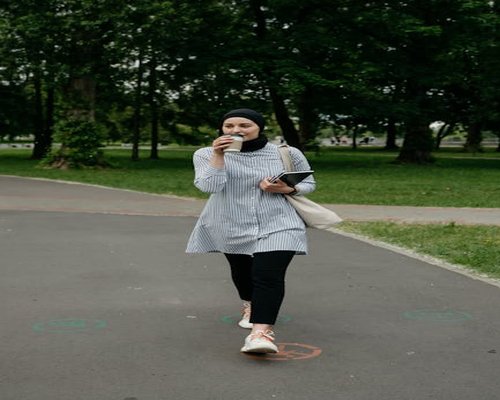Person walking in a sunny park lifestyle
